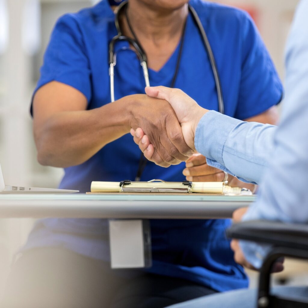 image of a nurse shaking hands